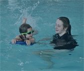 A swimming instructor teaching swimming