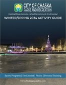 Cover Picture of Winter/Spring Activity Guide with a lighted big tree at Chaska's Firemens Park