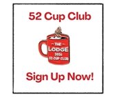 Man smiling holding his 52 Cup Club lapel pin.