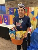 Man holding a prize basket from Lodge Game Night