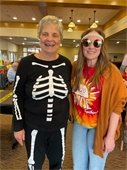 Pic of 2 ladies dressed in costume for Halloween at The Lodge