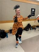 Halloween fun as a lady workouts and dances at the Friday fitness class. 