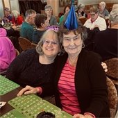 2 Ladies with New Years Hats smiling while at The Lodge New Years Bingo Bash