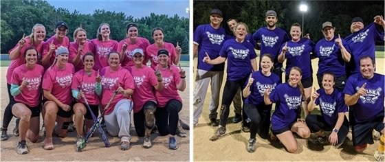Adult softball players smiling on the field