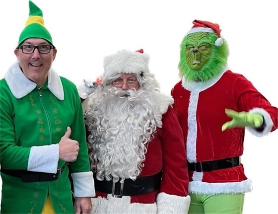 a picture of Santa, an elf and the Grinch