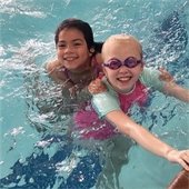 Two girls swimming