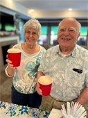 Smiling couple drinking root beer at the Summer Celebration.  Hosted on June 17, 4:00-6:00pm, Free at Carver Ridge Senior Living