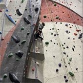 picture of kid climbing a climbing wall