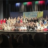 Group of kids performing a play on a stage