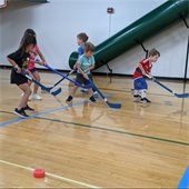 Picture of young kids playing floor hockey