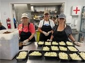 Volunteers preparing meals at The Humanity Alliance.