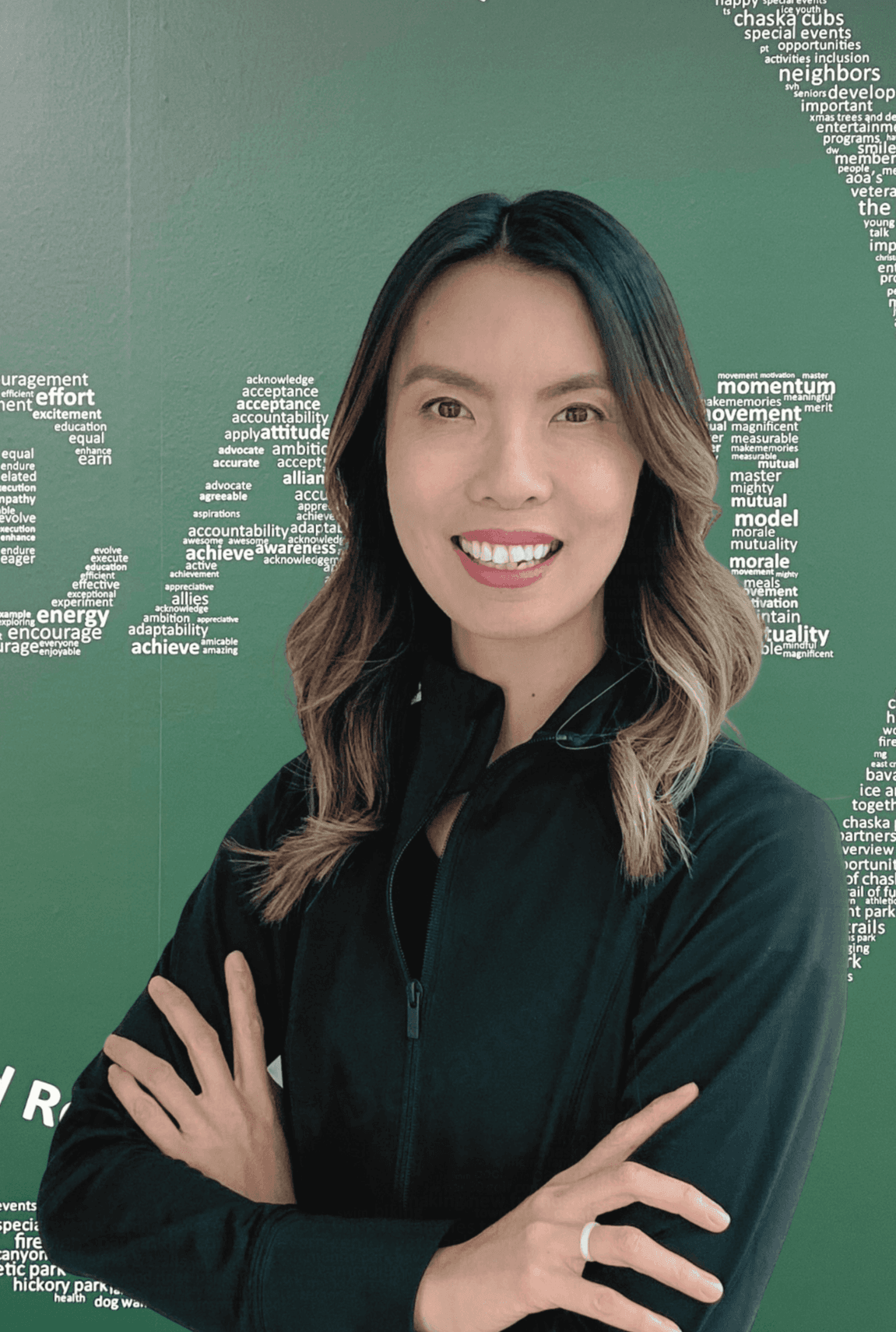 Shya Personal Training photo in front of Green TEAM poster